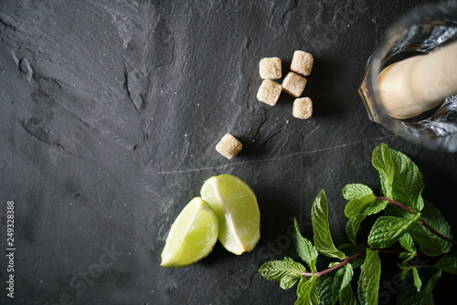 Top view of virgin mojito ingredients on slate with text space