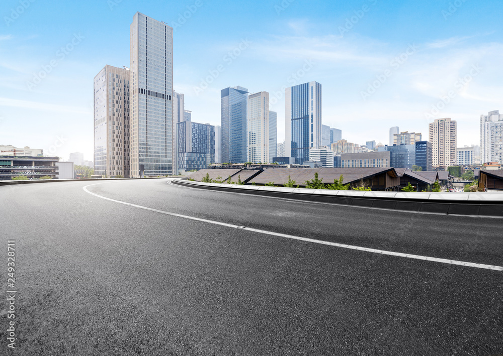 The expressway and the modern city skyline are in Chongqing, China. The expressway and the modern city skyline are in Chongqing, China.