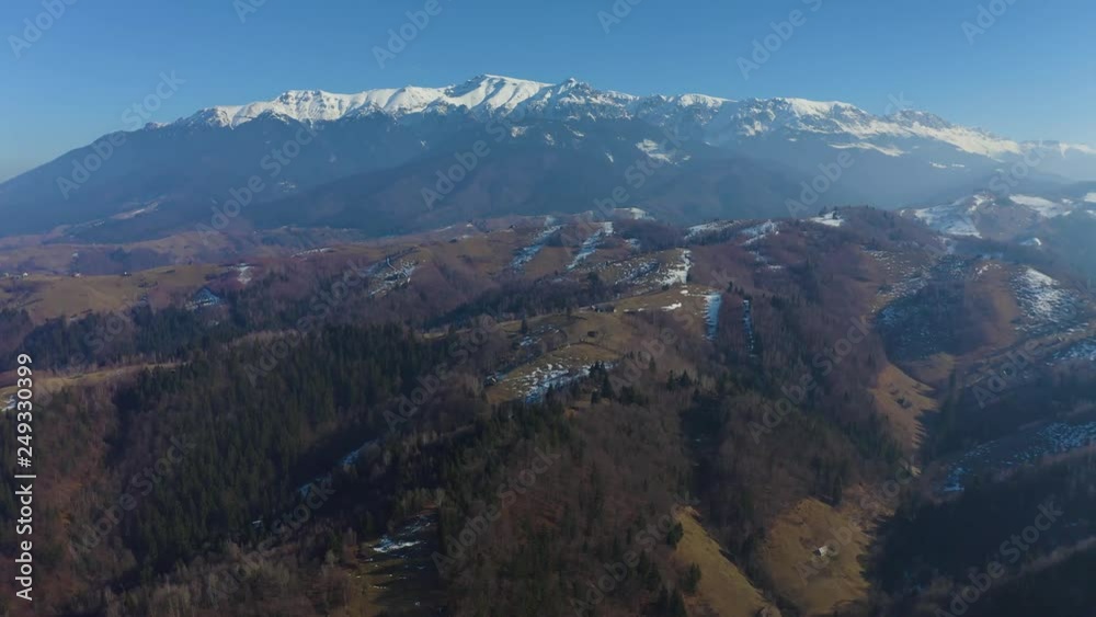 Drone flying towards snowy peaks mountain range Drone flying towards snowy peaks mountain range