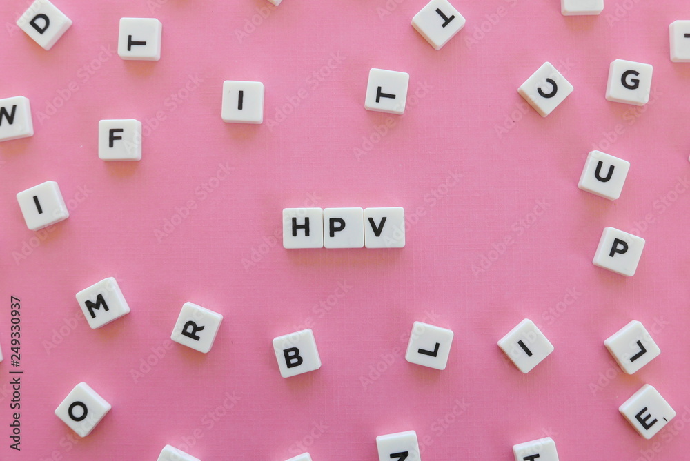 HPV (Human Papillomavirus) acronym word made of square letter word on pink background.