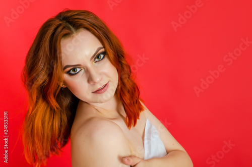 Sexy nude woman on red background. Close-up portrait. Cosmetology. Care. Women's health. Sexuality.
