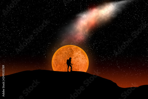 silhouette of hiker woman walking on a mountain ridge with full moon and a sky full of star