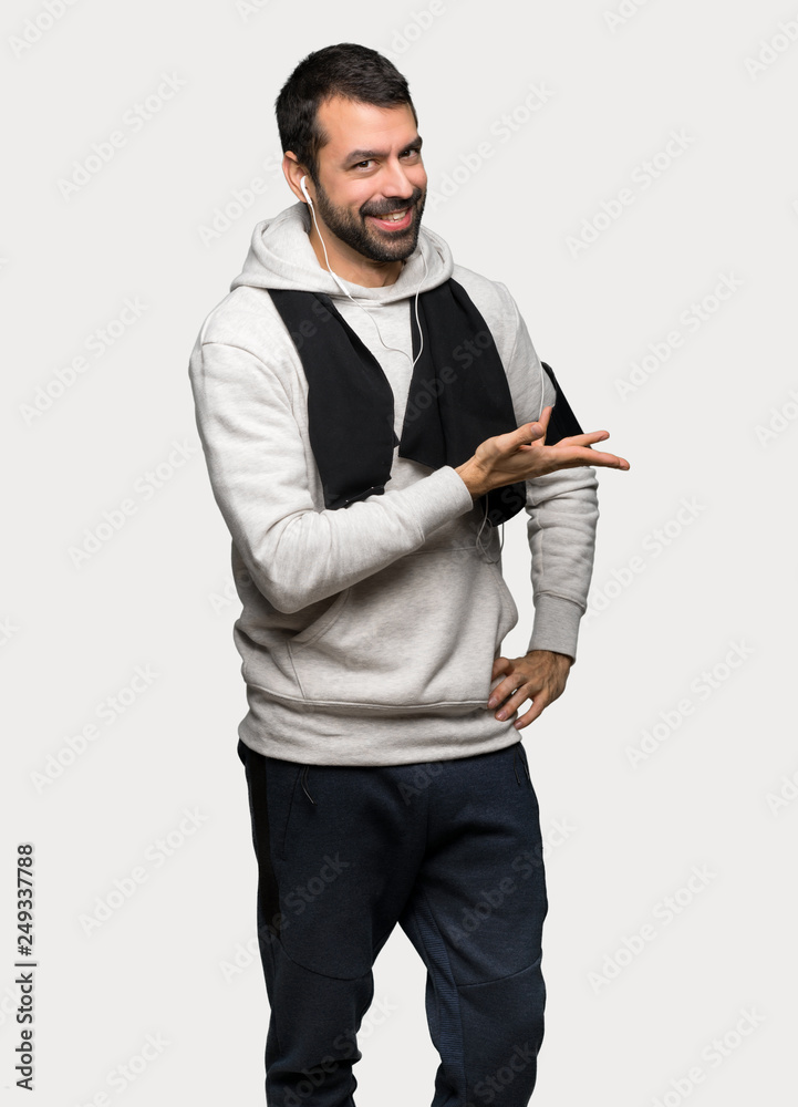 Sport man on back position looking back while scratching head over isolated grey background Sport man on back position looking back while scratching head over isolated grey background
