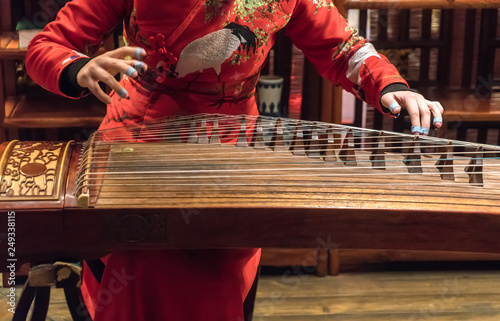 Women are playing zither, Chinese instruments