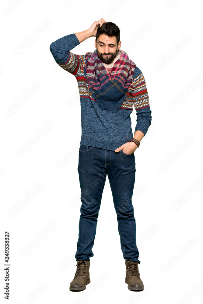 Full-length shot of Hippie man having doubts while scratching head on isolated white background Full-length shot of Hippie man having doubts while scratching head on isolated white background