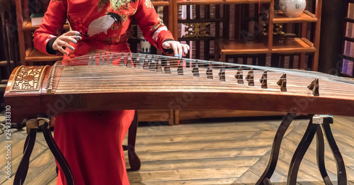 Women are playing zither, Chinese instruments