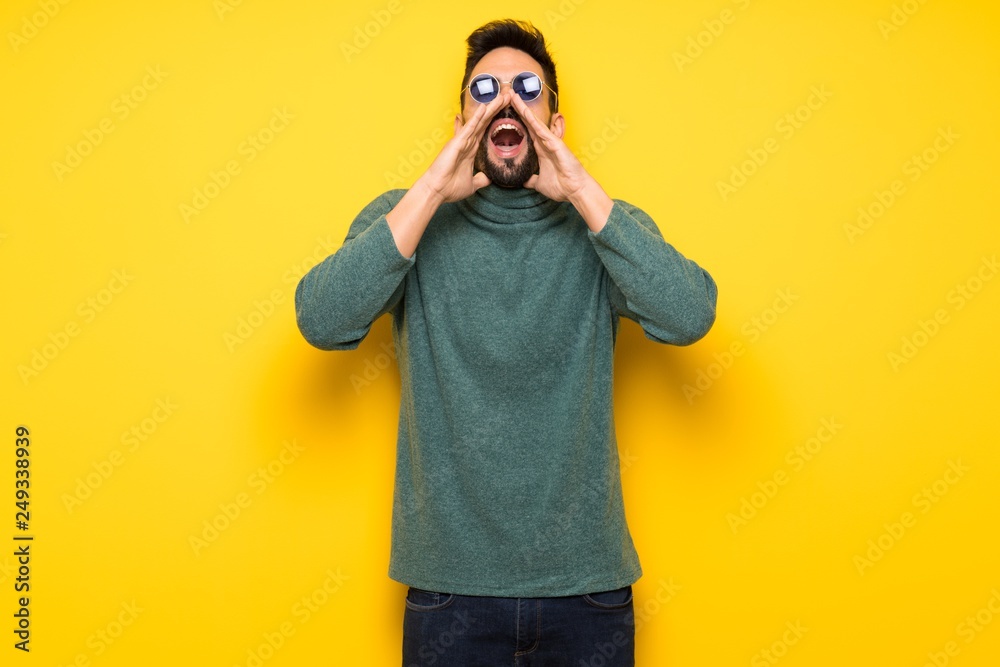 Handsome man with sunglasses shouting and announcing something Handsome man with sunglasses shouting and announcing something