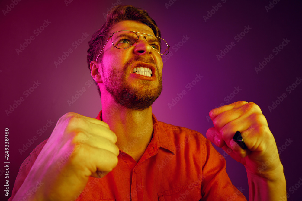 Screaming, hate, rage. Crying emotional angry man screaming on pink ...