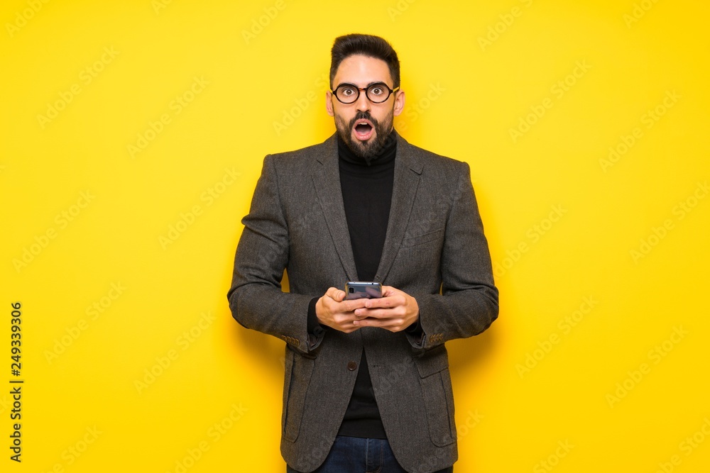 Handsome man with glasses surprised and sending a message Handsome man with glasses surprised and sending a message