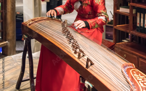 Women are playing zither, Chinese instruments