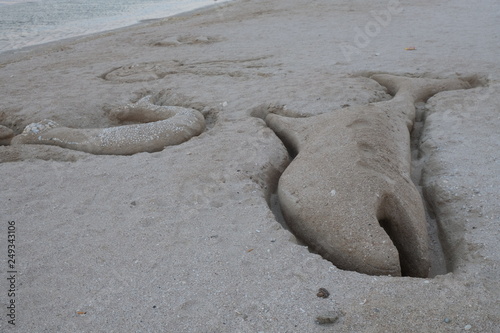 footprint on the sand sea stret photo