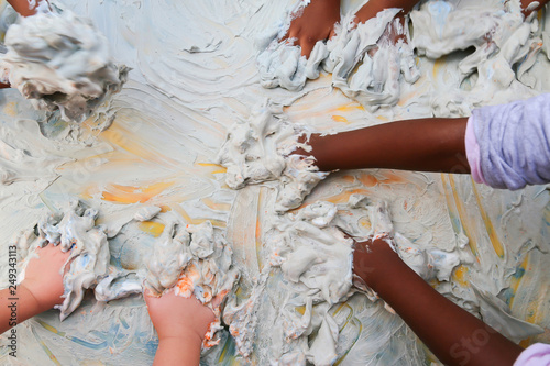 Messy play at preschool with foam and gel