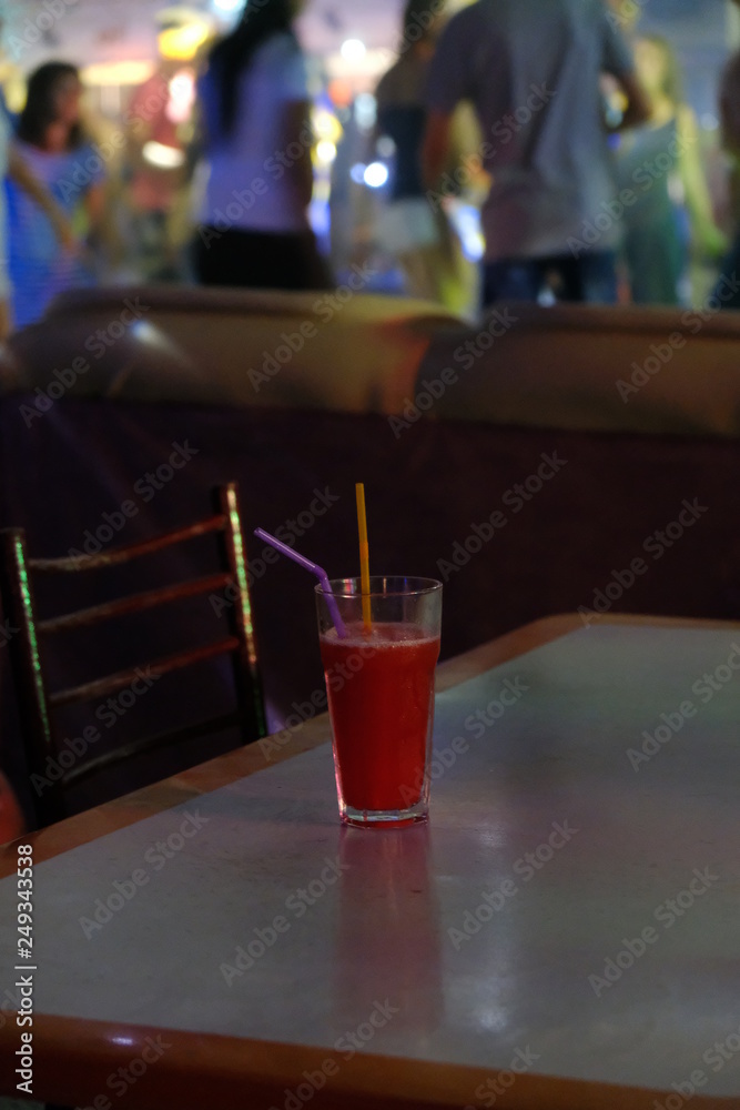 a glass with a drink in the summer on vacation on the table a glass with a drink in the summer on vacation on the table