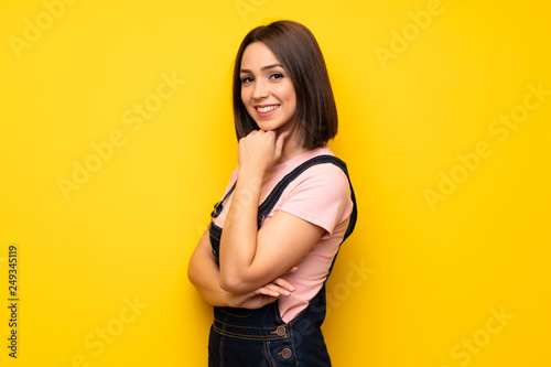 Portrait of young woman over white wall