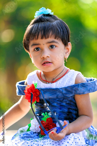 Indian Little Girl child writing on note book   studying 