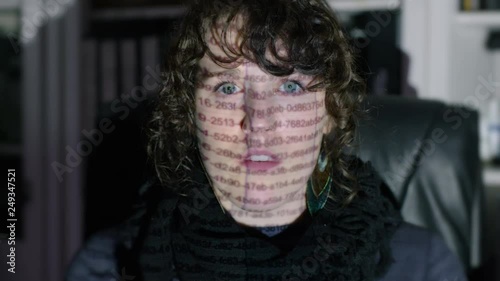 Woman working in office is overwhelmed by numbers from spreadsheet on face