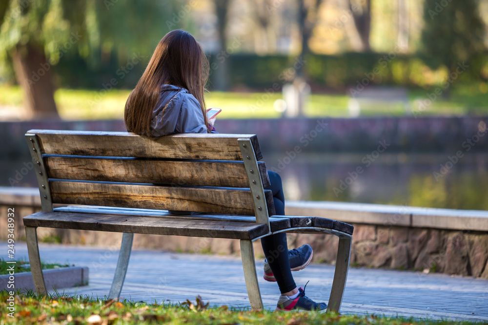 Download A 3d Model Of A Girl Sitting On A Bench Wallpaper