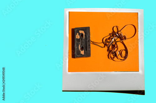 Instant photo on colored blue soft background.