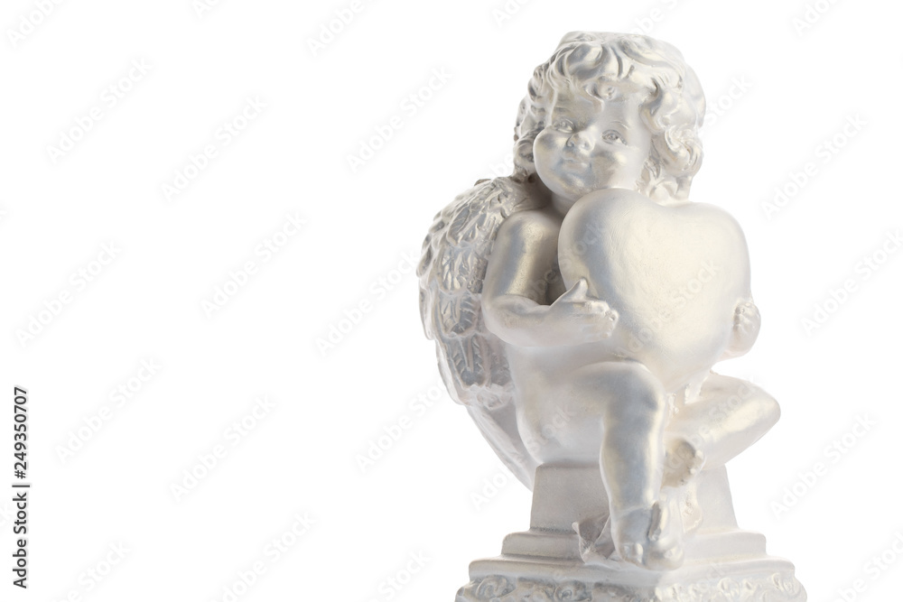 Cherub statue isolated on white background. Angel holds the heart. Love