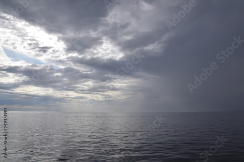 The Sea in a grey overcast day with a view of the horizon © Алексей Комаров