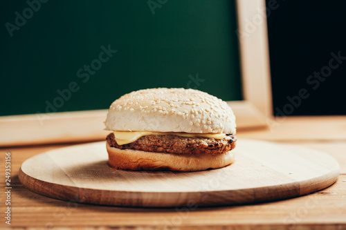 Wallpaper Mural Delicious homemade cheeseburger on wooden table Torontodigital.ca