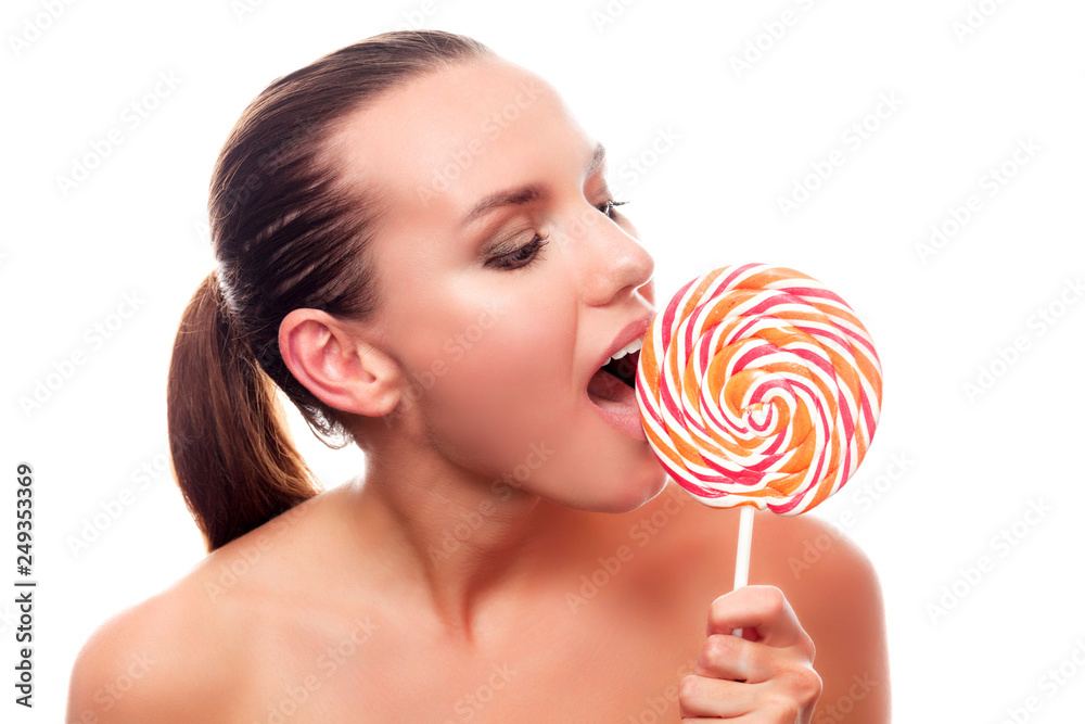 Pretty woman with big lollypop, isolated on white background