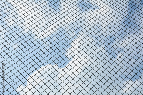 the cage metal net on blue sky background - pattern style