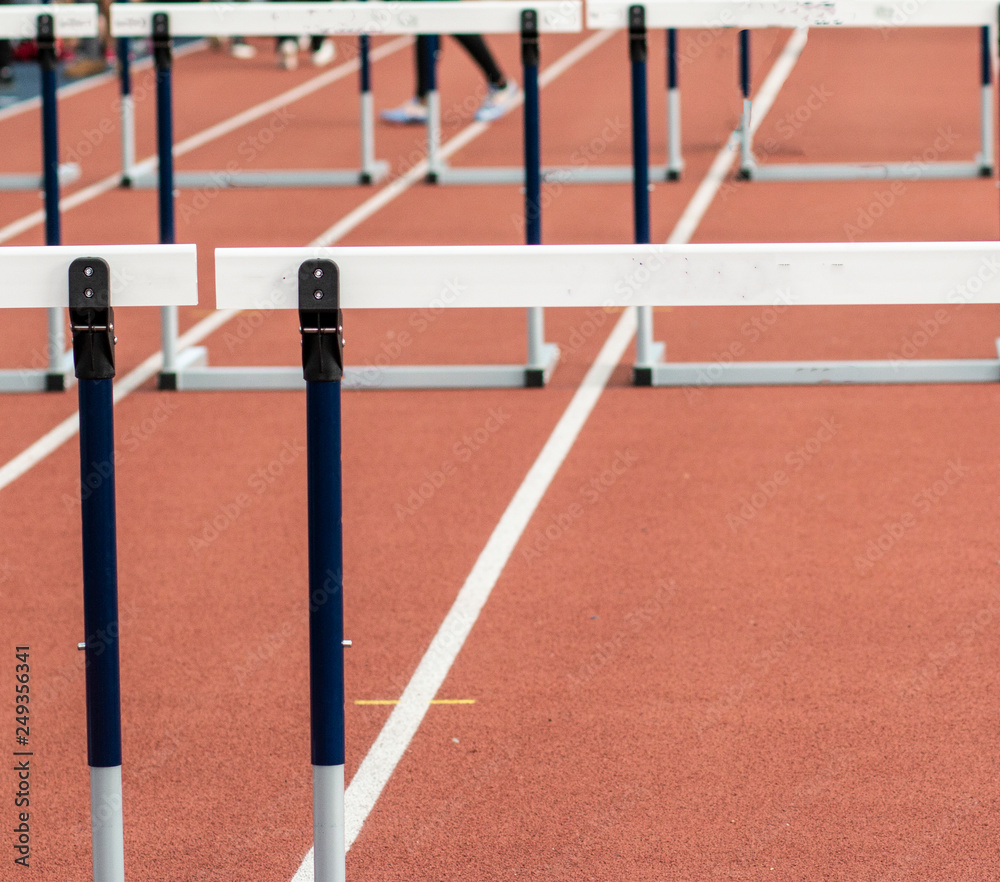 Hurdles on a red indoor track
