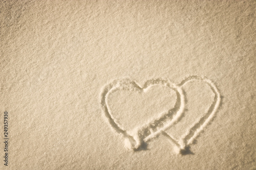 Heart drawn on the snow - composition with copy space  lettering template  text  design. Postcard template. The concept of the holiday.