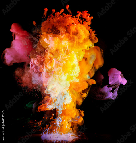 Acrylic colors and ink in water. paint on a black background, the best photo