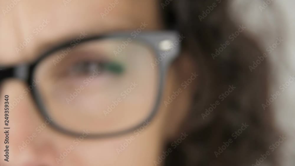 Woman coming closer to the camera. Poor seeing woman with glasses. Woman coming closer to the camera. Poor seeing woman with glasses.