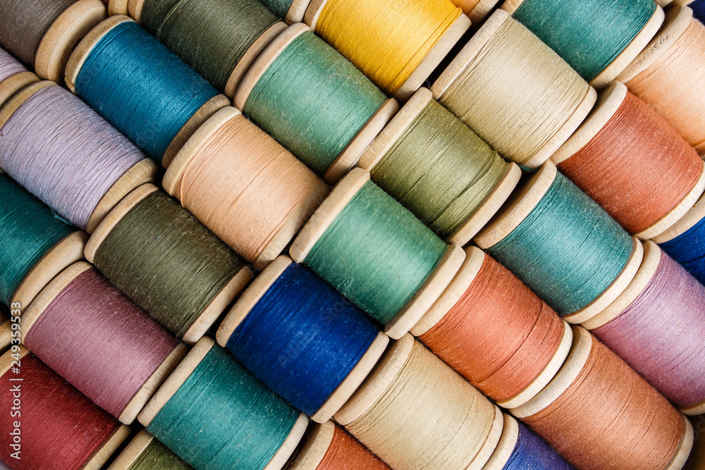 rolls of colorful threads, close-up and top view. rolls of colorful threads, close-up and top view.
