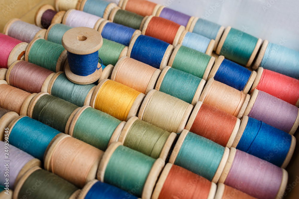 rolls of colorful threads, close-up and top view. rolls of colorful threads, close-up and top view.