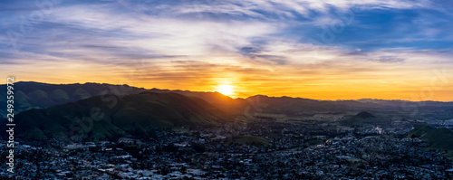 Картината върху платно Panoramic Sunrise above Mountain and City