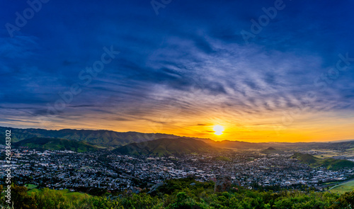 Sun, Clouds, Mountains, City at Sunrise 