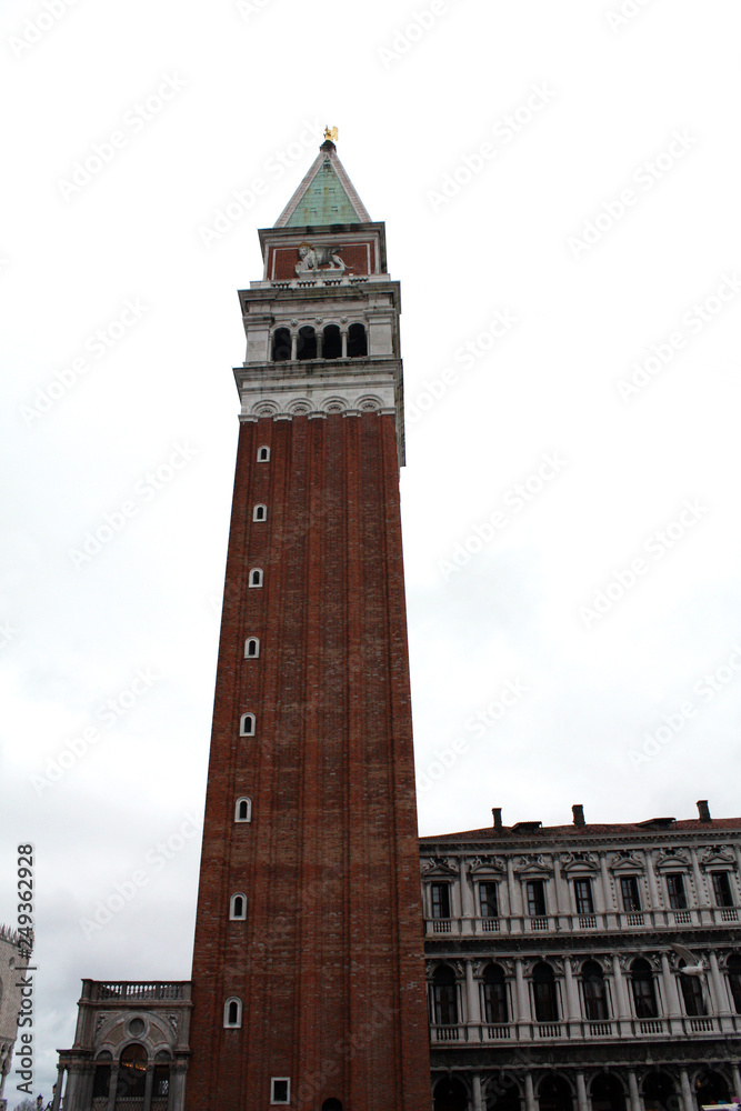 Venice / Italy - February 02 2018. Saint Mark square in Venice Italy. Bell Tower. San Marco Campanile Bell Tower in Venice. Campanile di San Marco. Saint  Mark square in Venice Italy. The Procuratie.