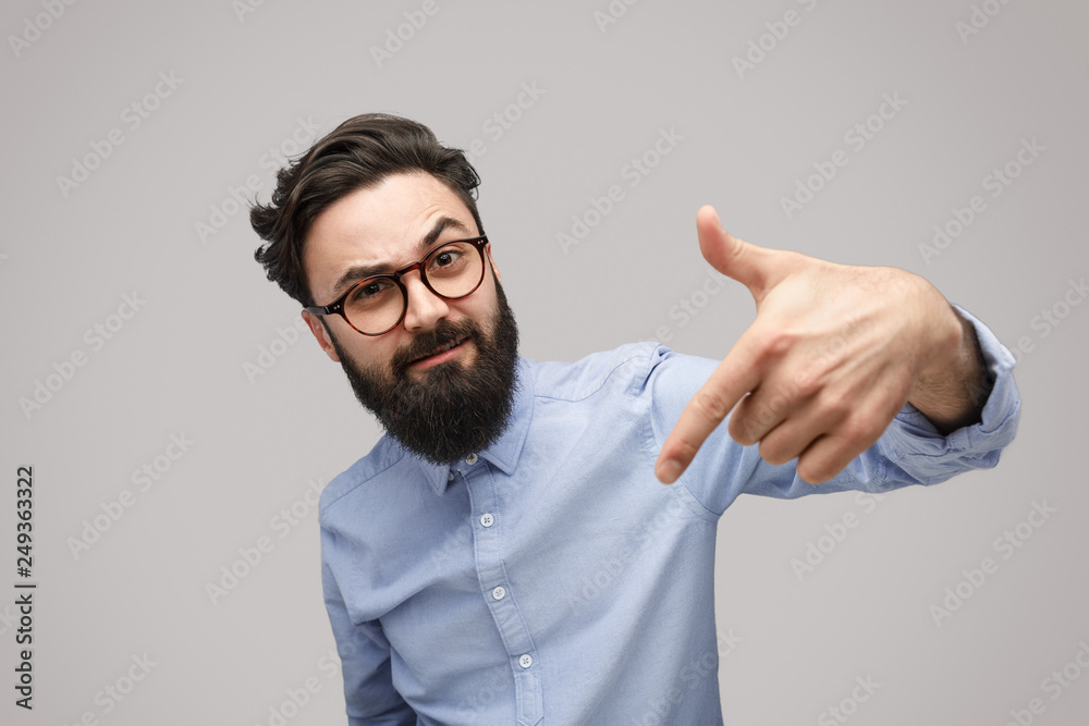 Bully man gesturing at camera in challenge Bully man gesturing at camera in challenge