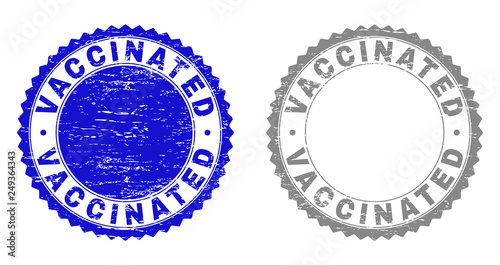 Grunge VACCINATED stamp seals isolated on a white background. Rosette seals with grunge texture in blue and gray colors. Vector rubber watermark of VACCINATED text inside round rosette.