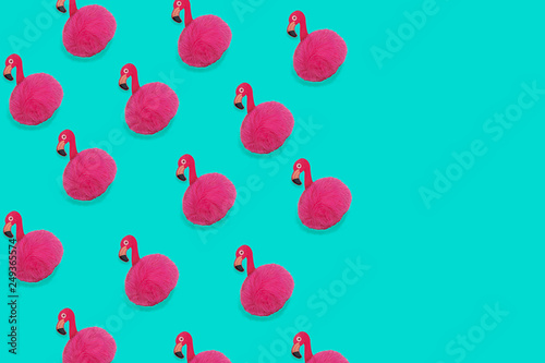 Pink Flamingo toy pattern on trendy blue background with copy space. Flamingo time for rest and relax. Creative layout summer concept for gift birthday party. Minimal style, flat lay, top view