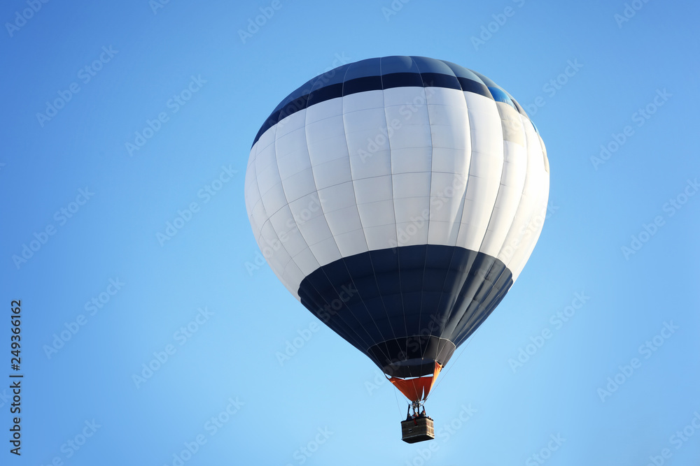 Fototapeta premium Beautiful view of hot air balloon in blue sky