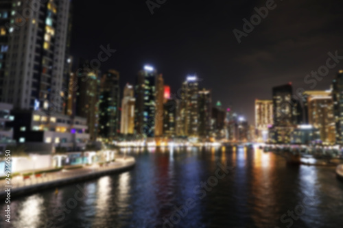 DUBAI  UNITED ARAB EMIRATES - NOVEMBER 03  2018  Night cityscape of marina district with illuminated buildings  blurred view