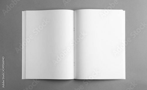 Mockup of open blank brochure on grey background, top view