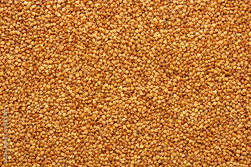 Buckwheat texture (lat. Fagopyrum esculentum). Source of vitamins, minerals and carbohydrates. Add to your diet diet, veganism. Background image, selective focus.