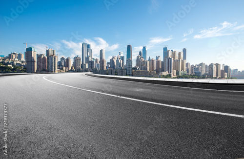 The expressway and the modern city skyline are in Chongqing  China.