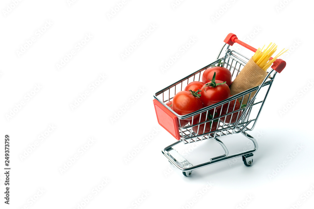 Food minimal concept. Tomatos and spaghetti (tomato pasta) in a toy shopping cart. Tiny kitchen concept. Pop art, contemporary art pattern