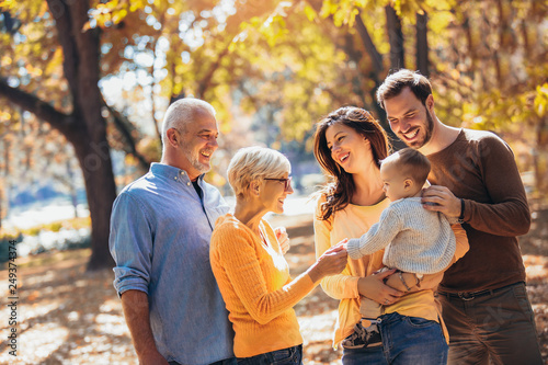 Multl generation family in autumn park having fun © Mediteraneo
