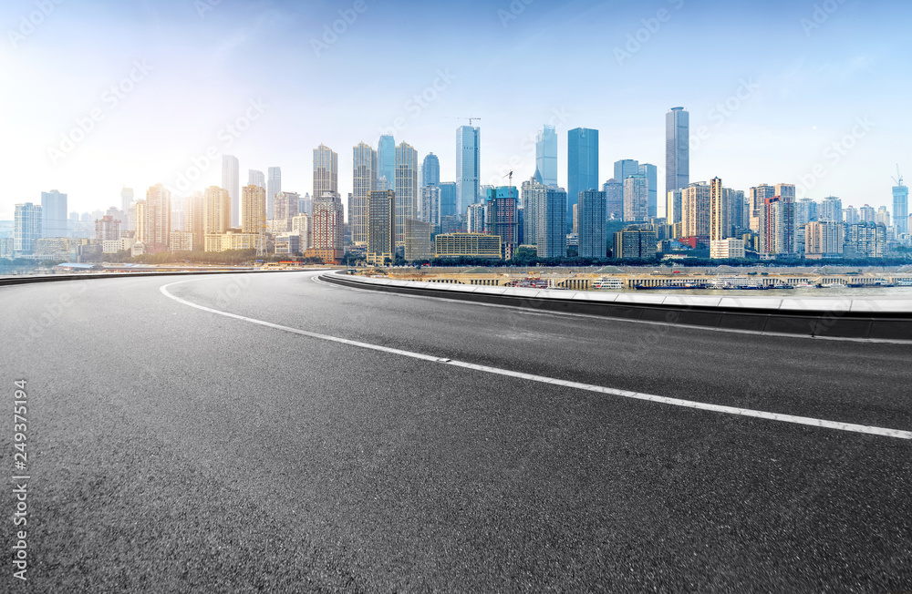 The expressway and the modern city skyline are in Chongqing, China.