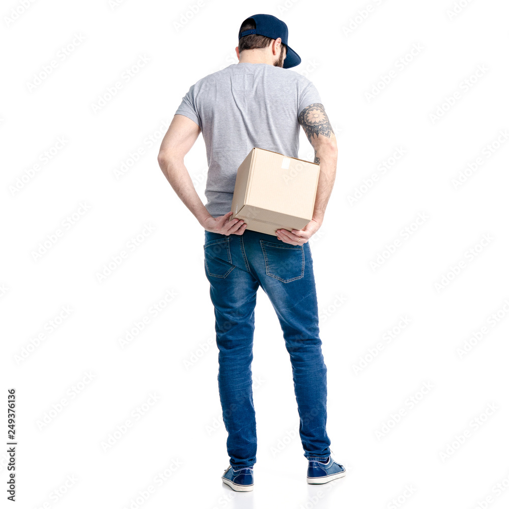 A man in jeans and cap holding box in hand on white background isolation, back viewbackground, white, man, box, people, male, red, person, work, service, professional, job, package, deliv A man in jeans and cap holding box in hand on white background isolation, back viewbackground, white, man, box, people, male, red, person, work, service, professional, job, package, deliv