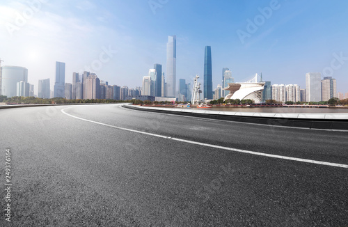 The expressway and the modern city skyline are in guangzhou, China.