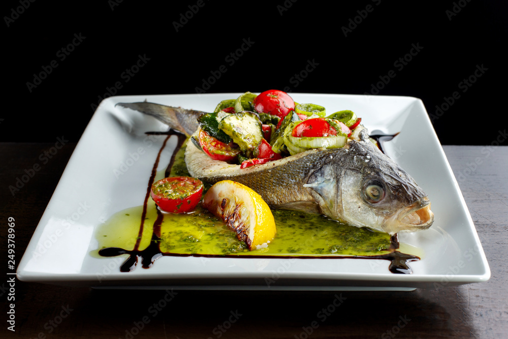Baked, stuffed fish. Filling of salted cucumbers, tomatoes and onions. Baked, stuffed fish. Filling of salted cucumbers, tomatoes and onions.